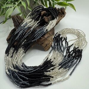 14-strand seed bead necklace, EUC. Ombré tones from black to clear. Pull-over.